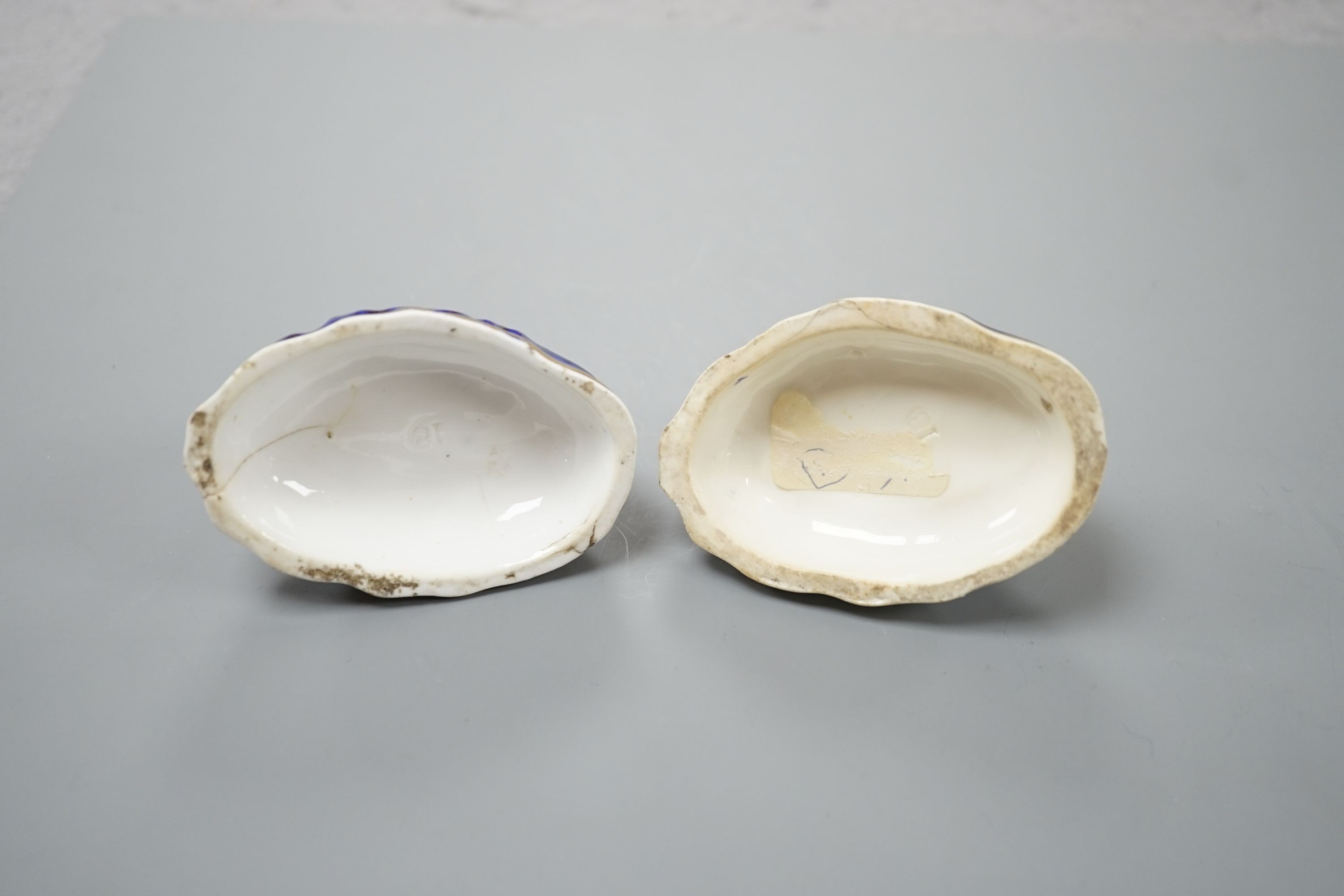 A pair of Samuel Alcock porcelain models of recumbent king Charles spaniels, c.1835-40, impressed mark 18, 7.3 cm long , Cf. Dennis G.Rice Dogs in English porcelain, colour plate 136 and 137., Provenance: Dennis G.Rice c